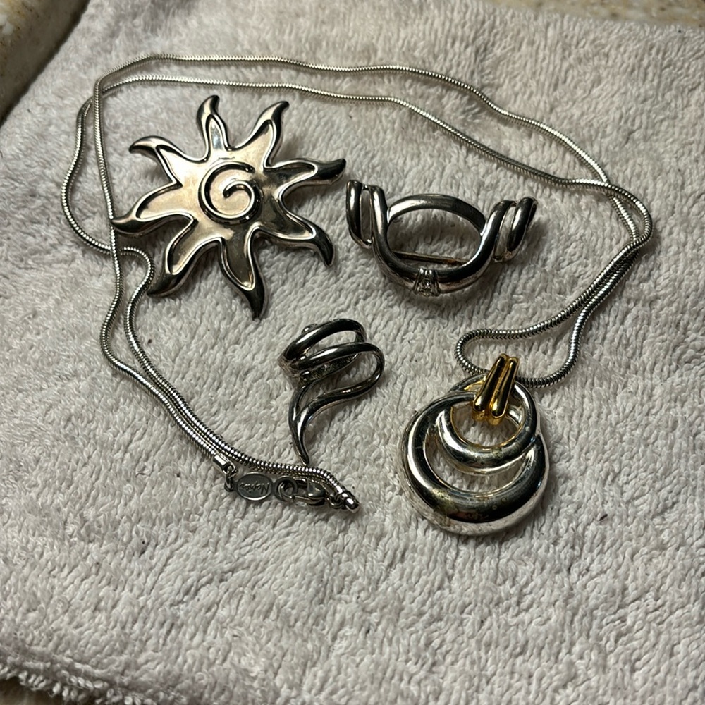Silver multi bundle pendants. Overall length of chain necklace by Napier 30” ￼